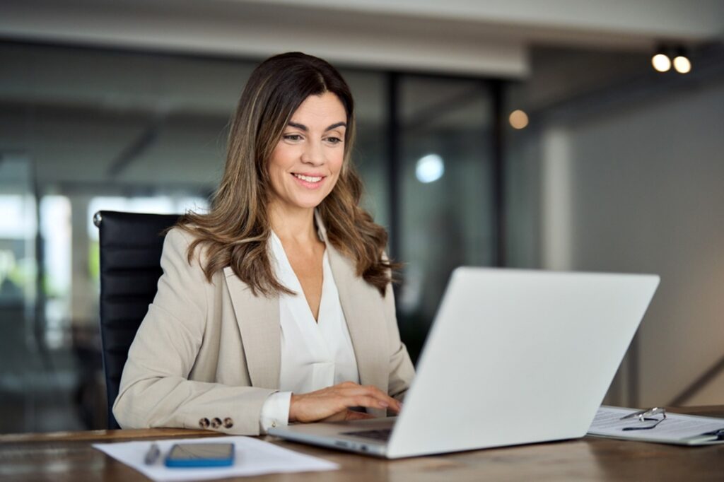 business woman on her laptop in an office setting