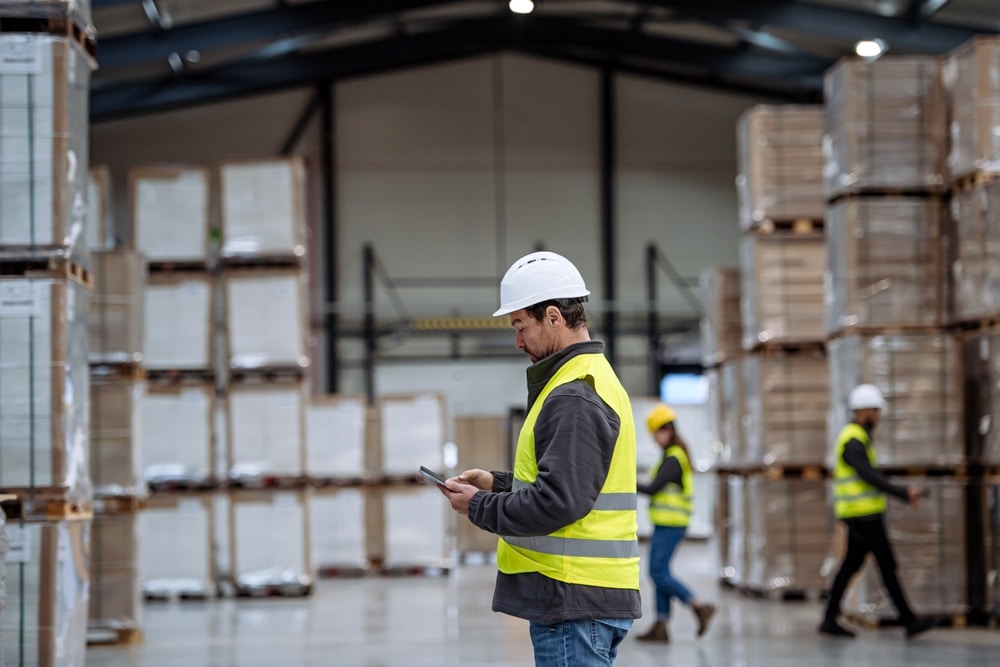 warehouse worker using epicor p21 edi integration on mobile device